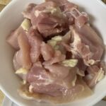 Cutting chicken into bite-sized pieces