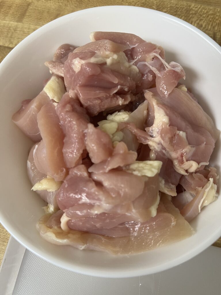 Cutting chicken into bite-sized pieces