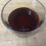 Mixing soy sauce, maple syrup, and rice vinegar