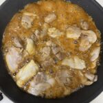 Simmering chicken in teriyaki sauce