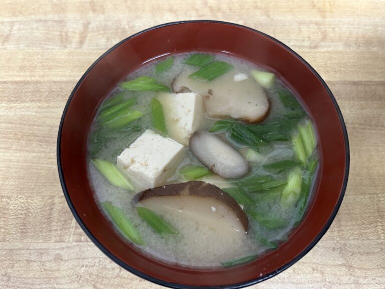 A warm bowl of Japanese miso soup made with Trader Joe’s ingredients — tofu, shiitake mushrooms, and green onions