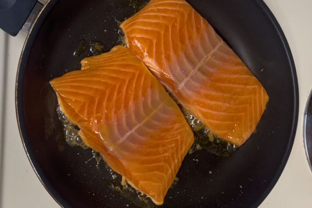 Cooking miso glazed salmon in a nonstick pan over medium heat