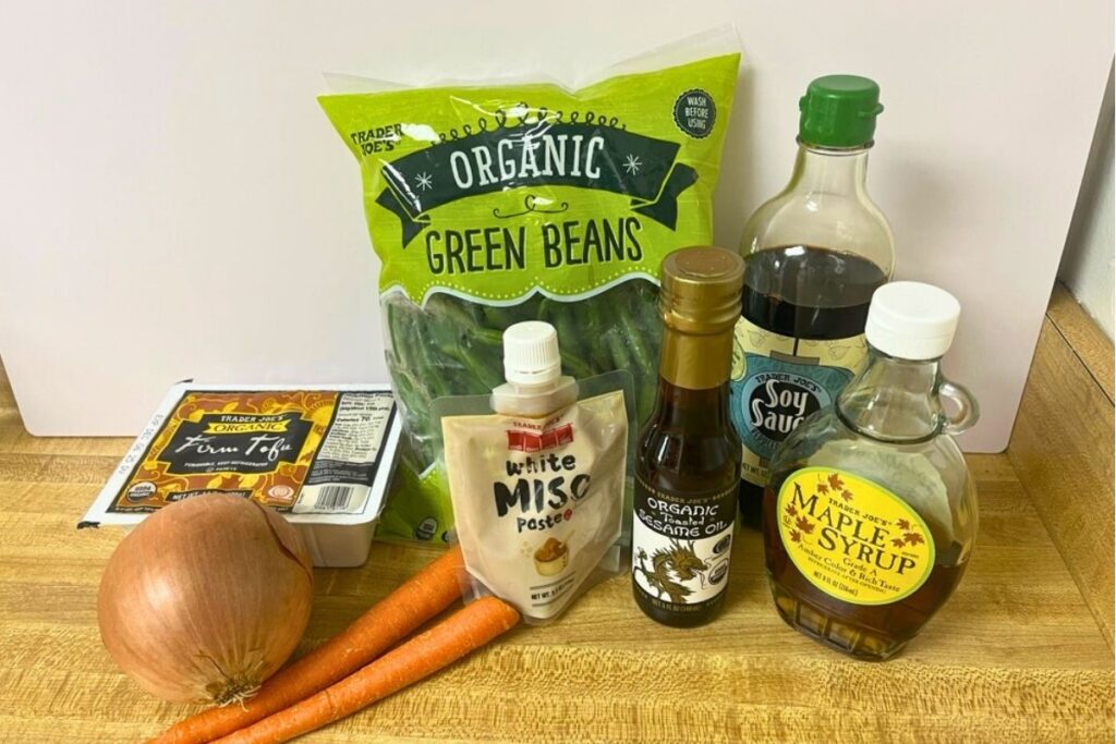 Trader Joe’s ingredients for miso tofu stir-fry, including white miso, tofu, soy sauce, sesame oil, maple syrup, and assorted vegetables.