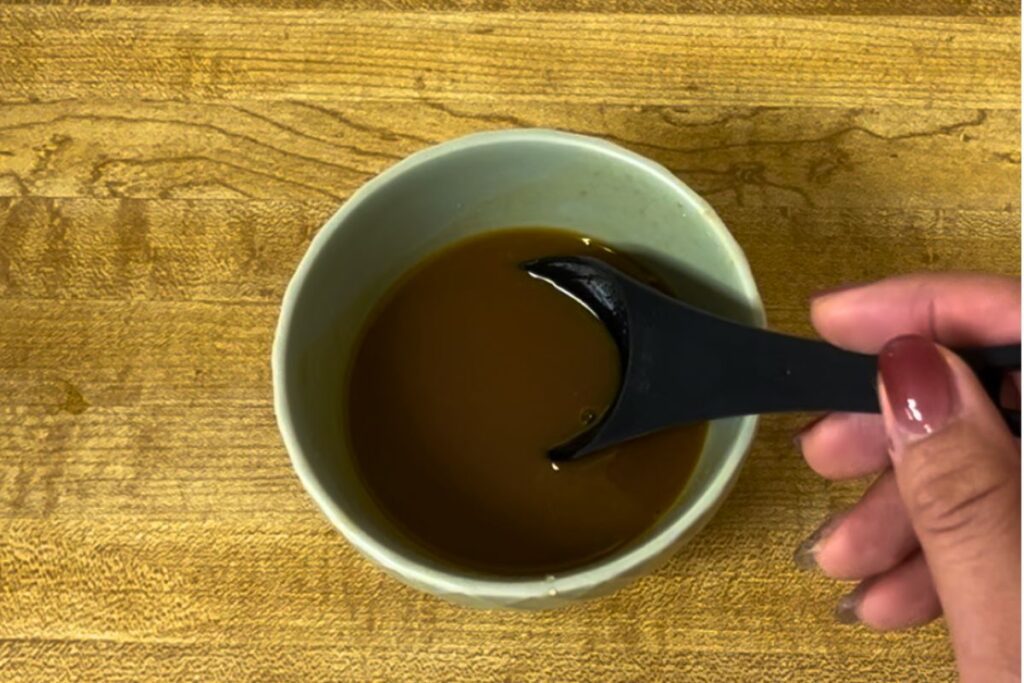 White miso, soy sauce, maple syrup, and water mixed to make miso stir-fry sauce.