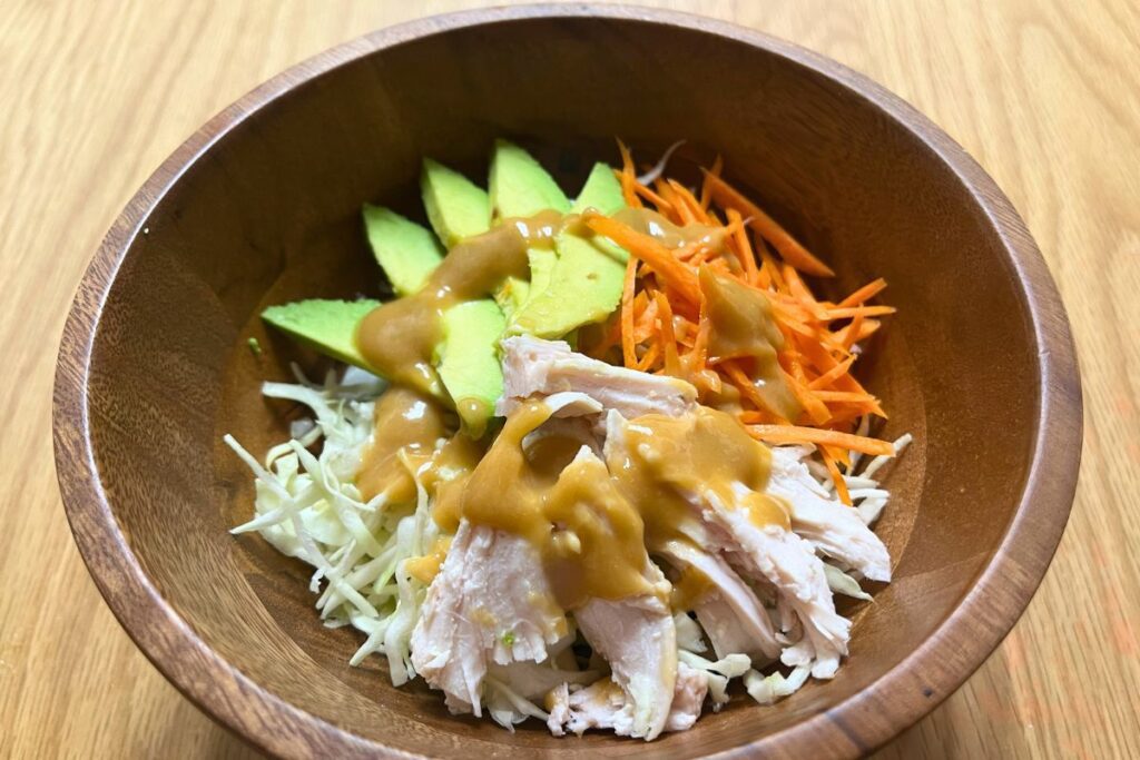 Shredded chicken and cabbage salad with miso dressing