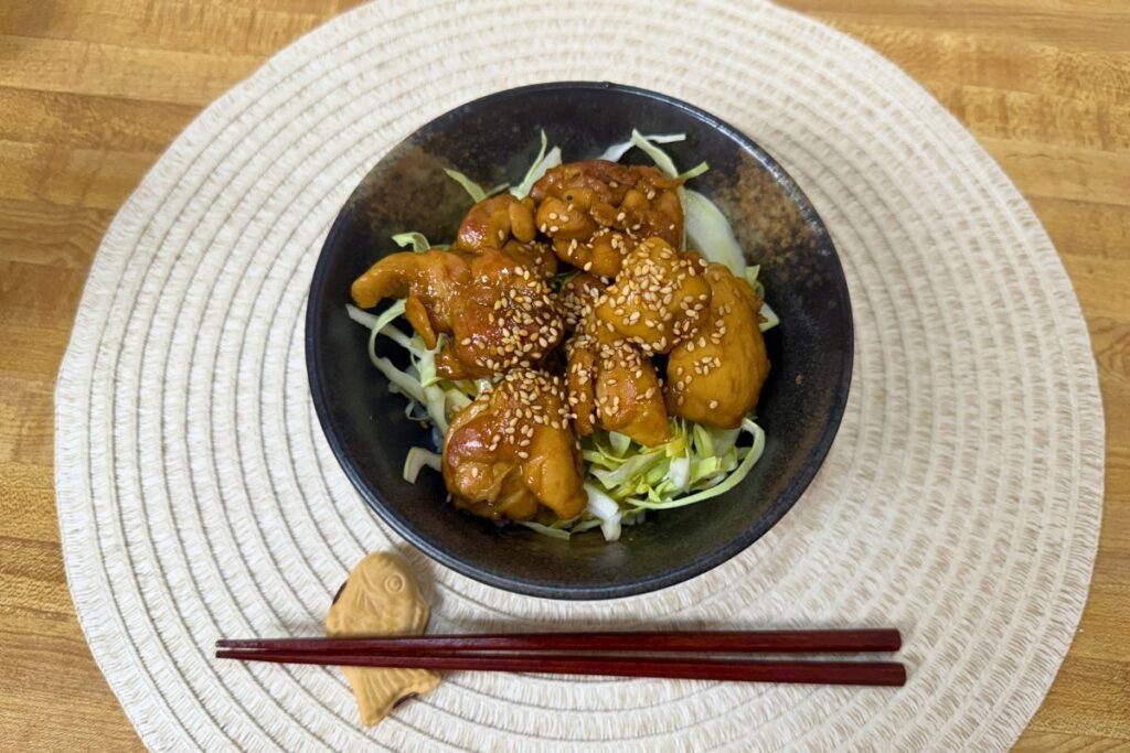 Teriyaki chicken rice bowl with shredded cabbage